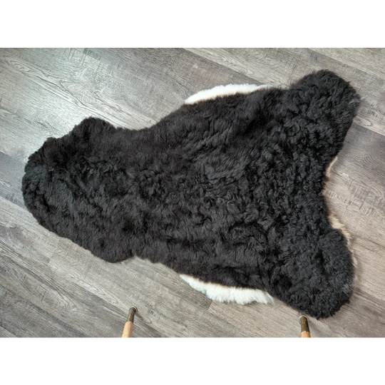 Black and white large soft luv8 icelandic sheepskin rug with curly plush short wool fur, 42 by 28 inches