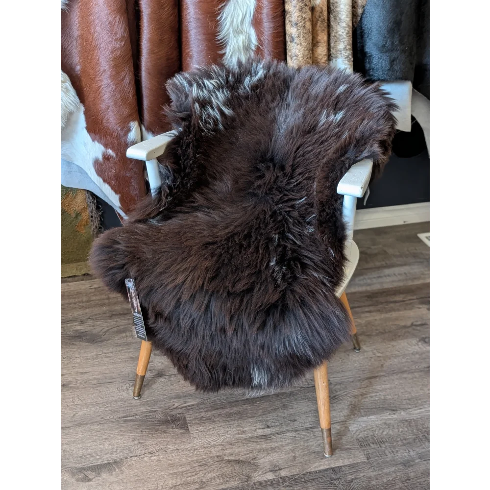 Modern rare British sheepskin chair cover with white legs, 47x28 inches