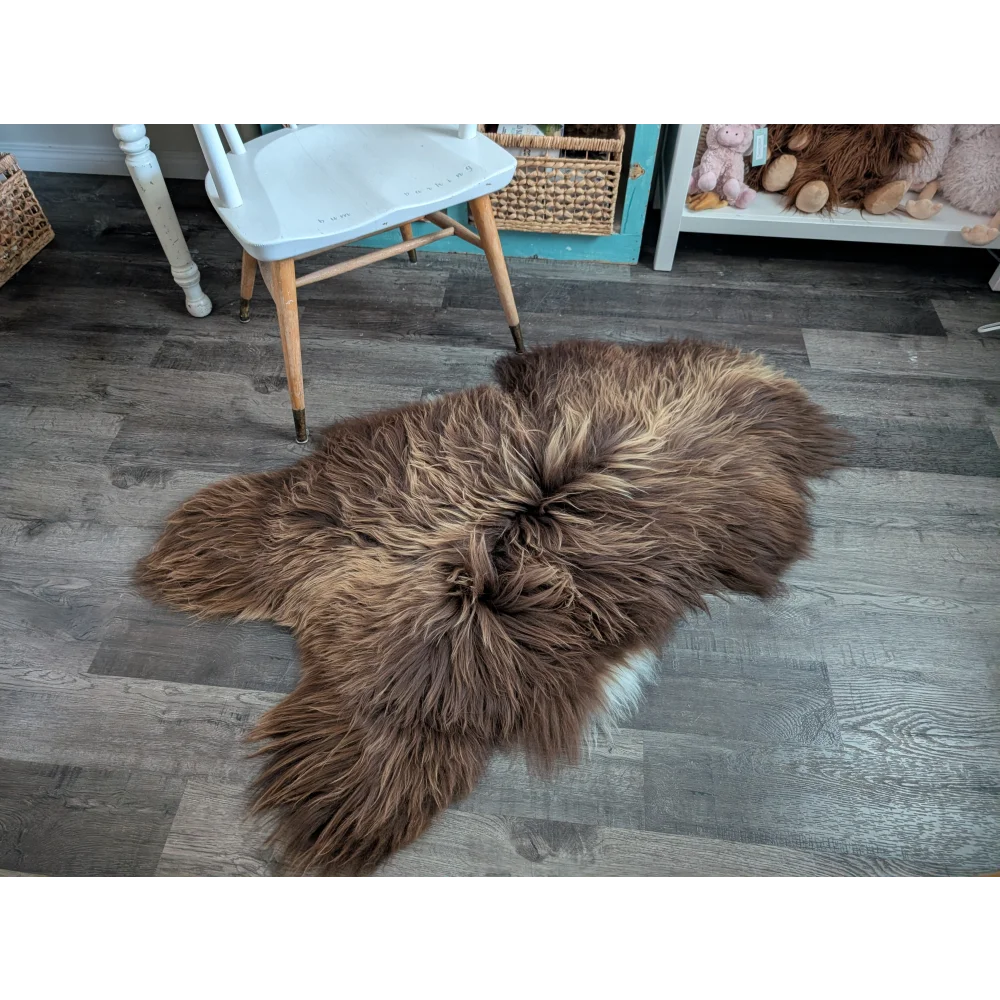 A plush brown long wool icelandic sheepskin rug with natural fluffy texture for cozy floor decor