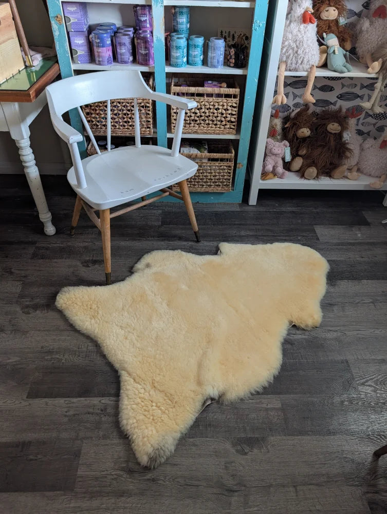 Cream-colored medical sheepskin rug with soft fluffy texture and natural edges from angus oliver washable product