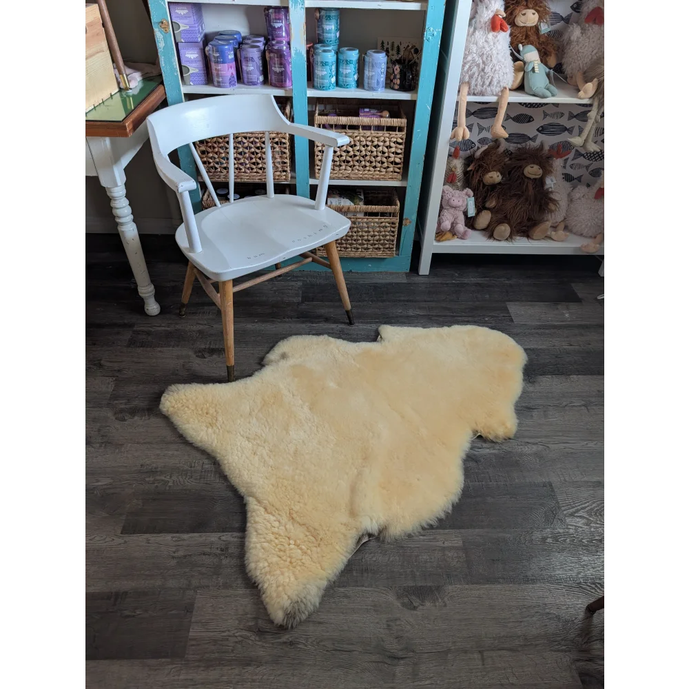 Cream-colored medical sheepskin rug with soft fluffy texture and natural edges from angus oliver washable product