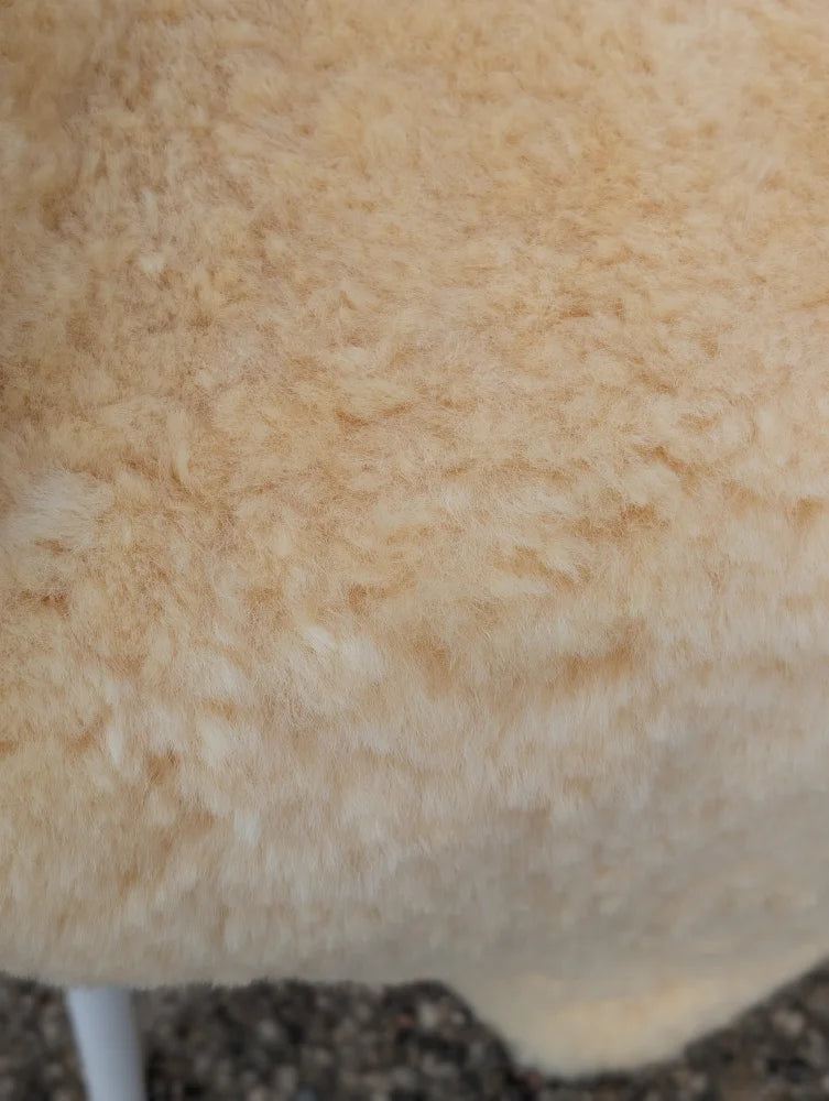 Cream-colored plush medical sheepskin with soft curly texture for extra large washable medical sheepskins