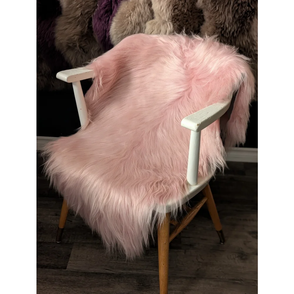 Pink Icelandic sheepskin fluffy chair cover with wooden legs