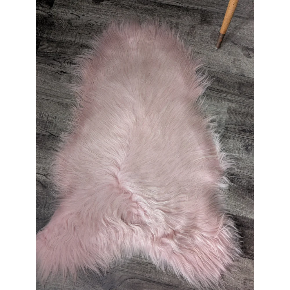 Soft pale pink M5 Grade A Icelandic sheepskin rug with plush fur texture