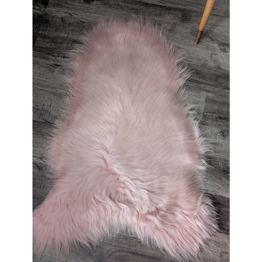 Soft pale pink M5 Grade A Icelandic sheepskin rug with plush fur texture