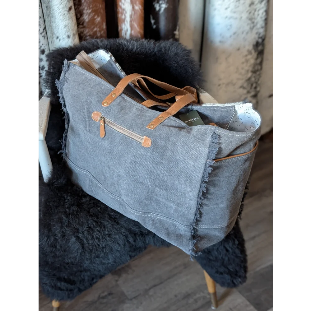 Matty Affair canvas hair on weekender bag with gray tote frayed edges