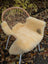 Cream-colored washable medical sheepskins chair cover with soft fluffy texture naturally spotted size medium