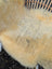 A soft creamy beige naturally spotted medical sheepskin rug with plush fluffy texture washable med22 46.5 by 22 inches
