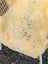 Cream-colored naturally spotted medical sheepskin rug with soft fluffy texture and dark gray speckles washable med26 model