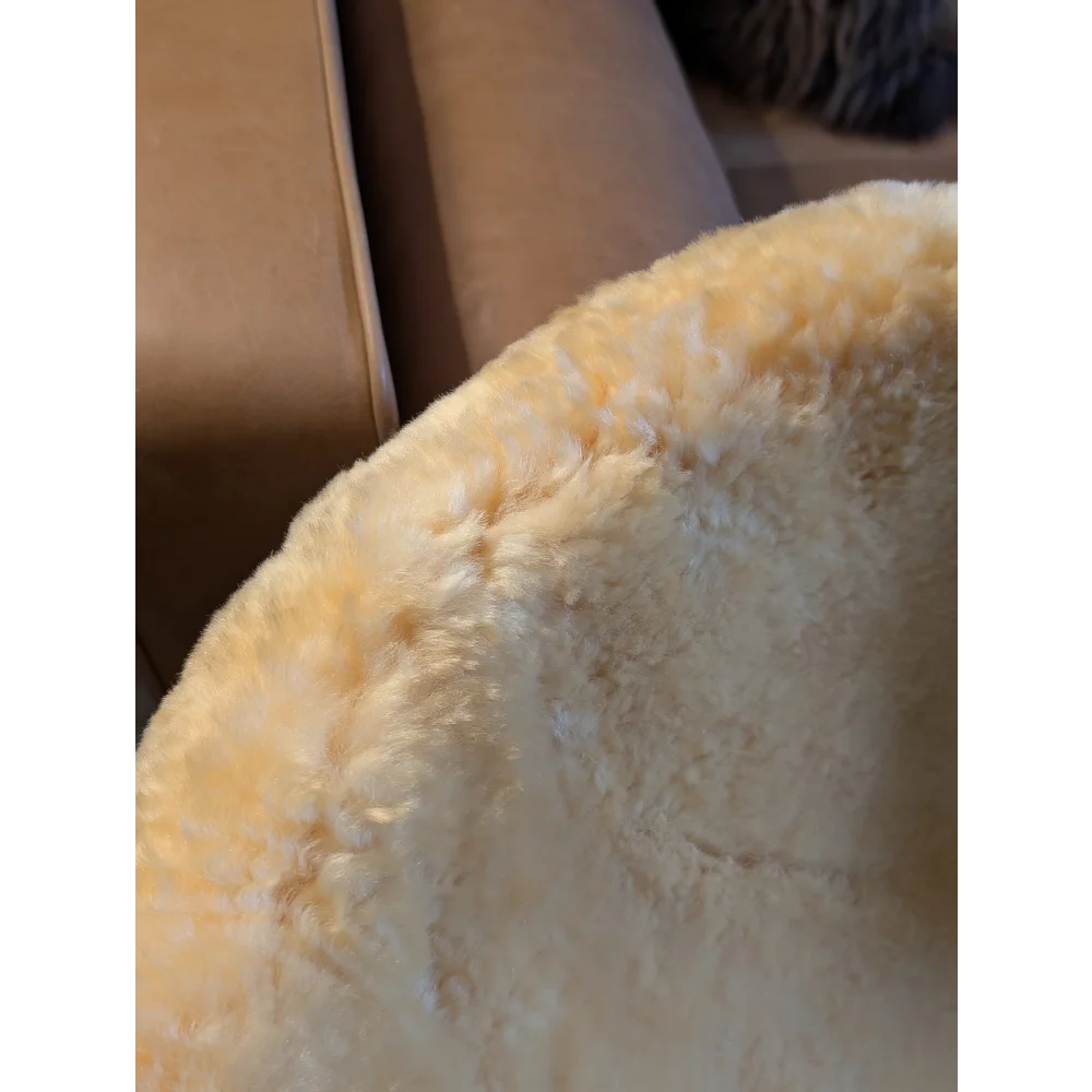 Cream-colored plush faux fur large medical sheepskin pet bed by angus oliver with soft textured surface