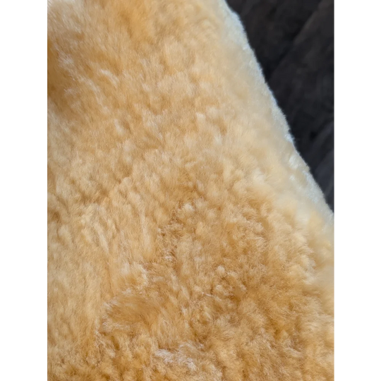 Soft creamy beige medical sheepskin with plush curly texture medium medical sheepskin by angus oliver