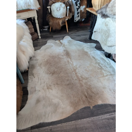 Medium 190 very soft large cowhide rug by angus oliver in natural beige and cream tones with fluffy texture beautiful rugs