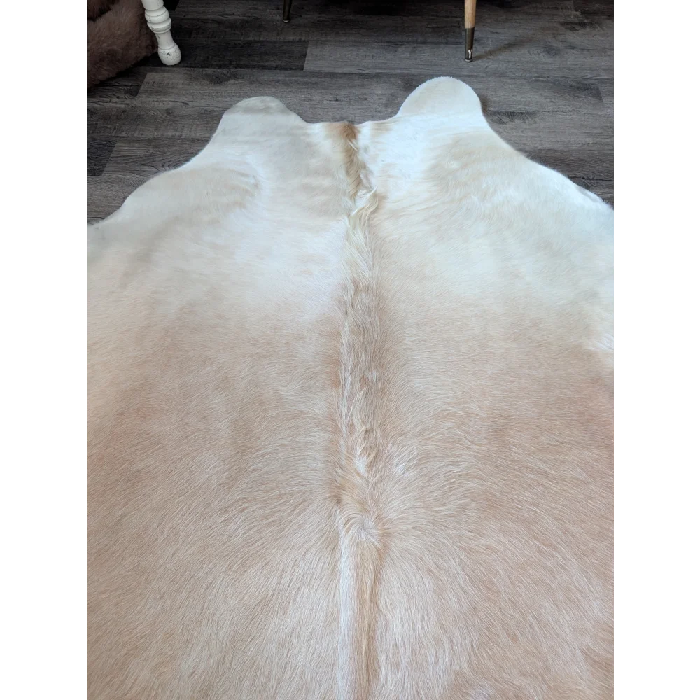 Medium 190 cream-colored large cowhide rug by angus oliver with natural fluffy texture and distinct central spine