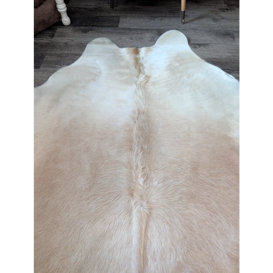 Medium 190 cream-colored large cowhide rug by angus oliver with natural fluffy texture and distinct central spine