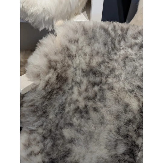 Medium dalmatian icelandic sheepskin rug with plush gray and white speckled short wool icelandic texture