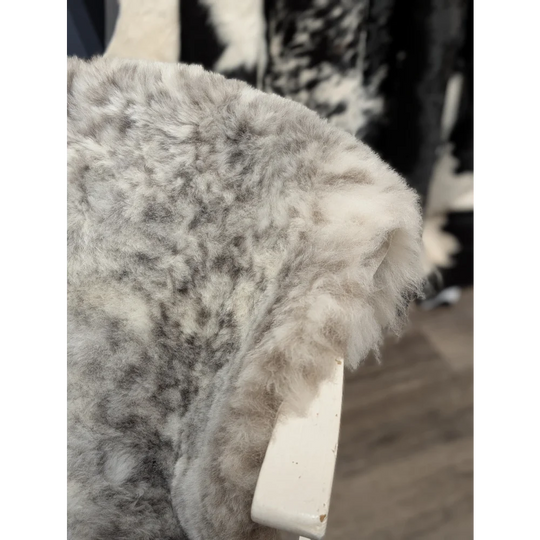 Medium dalmatian icelandic sheepskin rug in soft gray and white with fluffy short wool icelandic texture