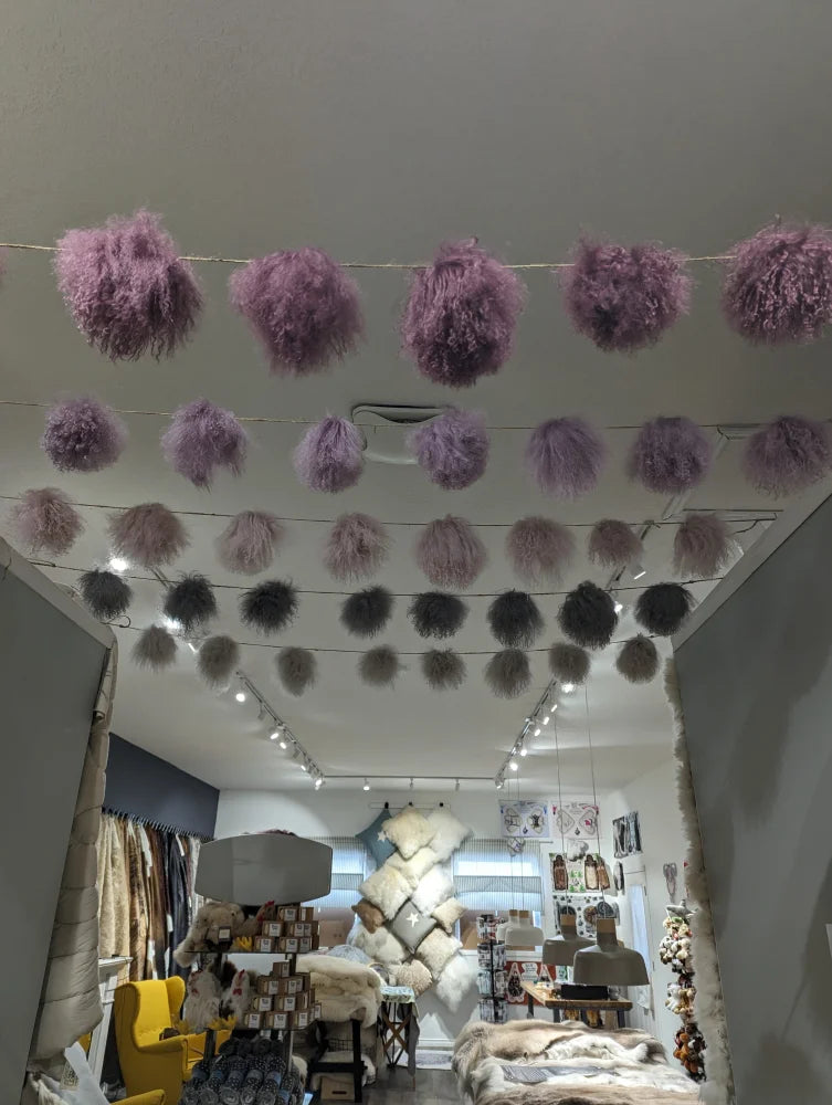 Medium pink sheepskin pom pom garland with lavender fur and silver accents