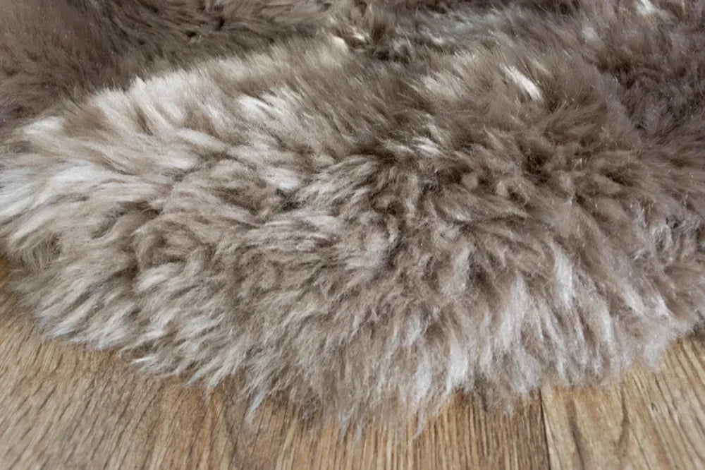 Medium taupe merino sheepskin cushion cover with plush gray faux fur texture and soft cotton backs arriving soon