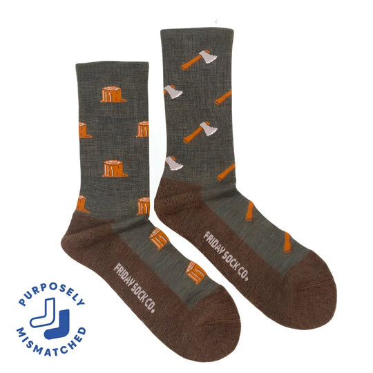 A pair of olive green and brown merino wool socks with orange tree stumps and axes perfect for hiking and trails