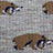 Gray knit merino wool socks with brown and navy badger pattern and pink accents for warm breathable wear