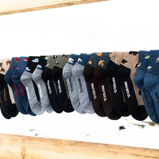 A collection of colorful patterned friday sock co men’s bear and tree merino wool socks soft trekking knit wool socks