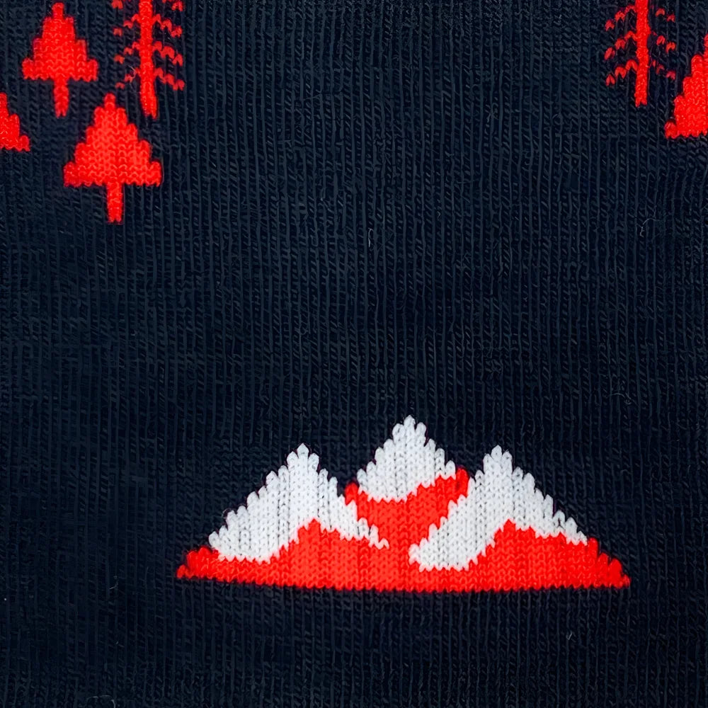 Men’s dark blue merino wool socks with red and white mountain design and embroidered pine trees for soft comfort
