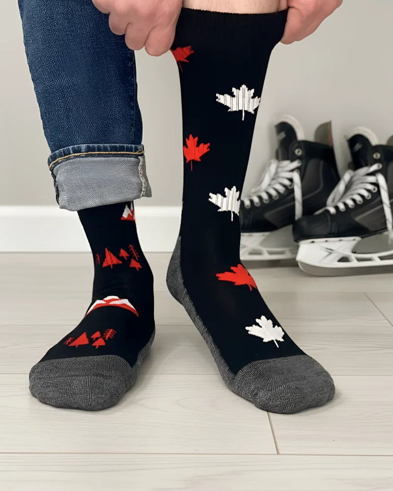 Men’s canada merino wool socks in black with red white maple leaf pattern and gray toe and heel for soft comfort