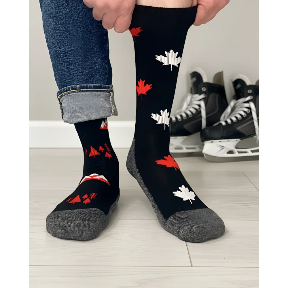 Men’s canada merino wool socks in black with red white maple leaf pattern and gray toe and heel for soft comfort