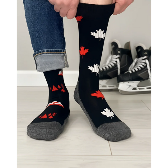 Men’s canada merino wool socks in black with red white maple leaf pattern and gray toe and heel for soft comfort