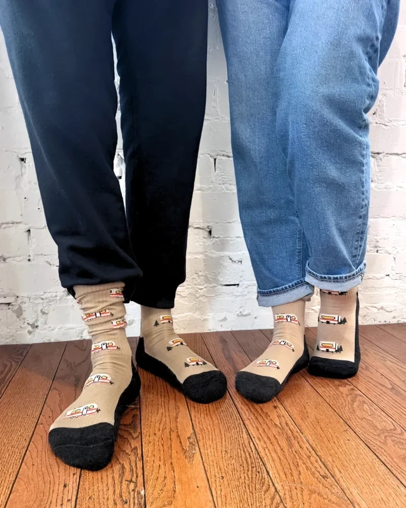 Beige merino wool socks with black toes and heels featuring colorful vintage camper vans for warm breathable wear