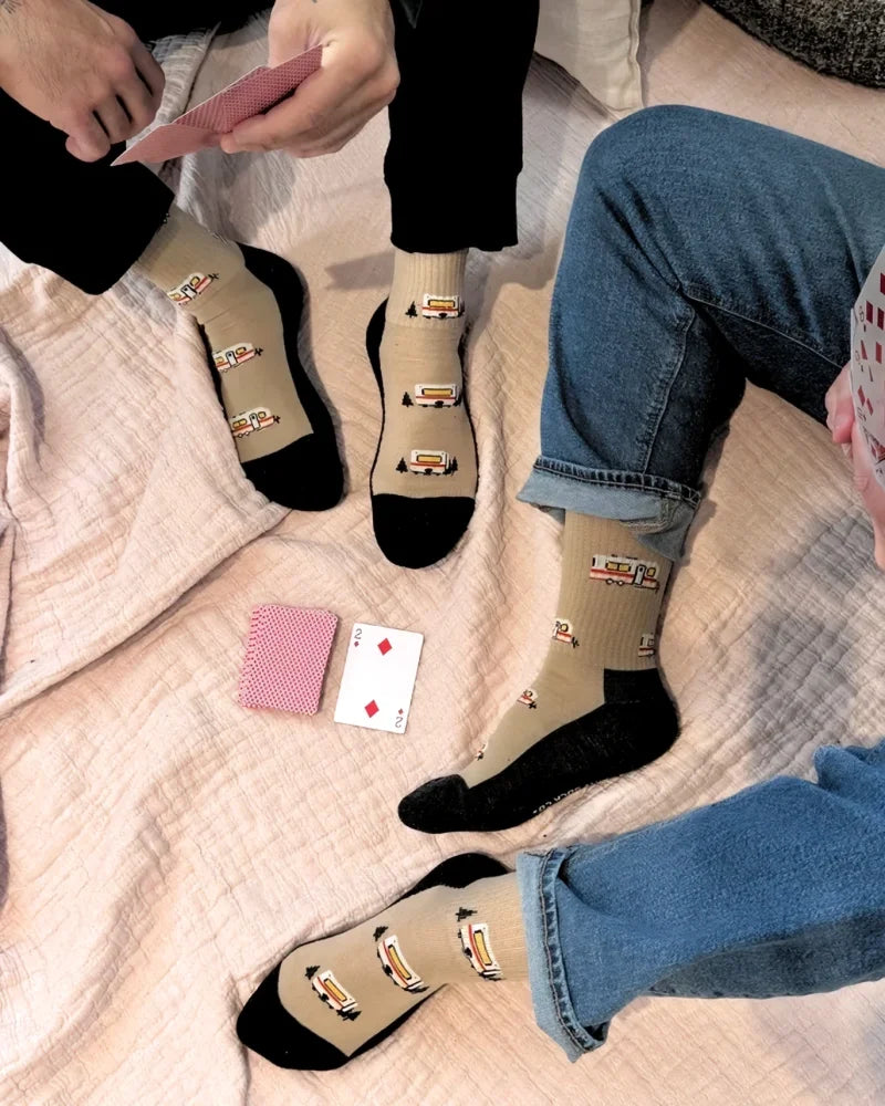 Beige merino wool socks with black toe caps and vintage camper van pattern perfect for warm breathable wear