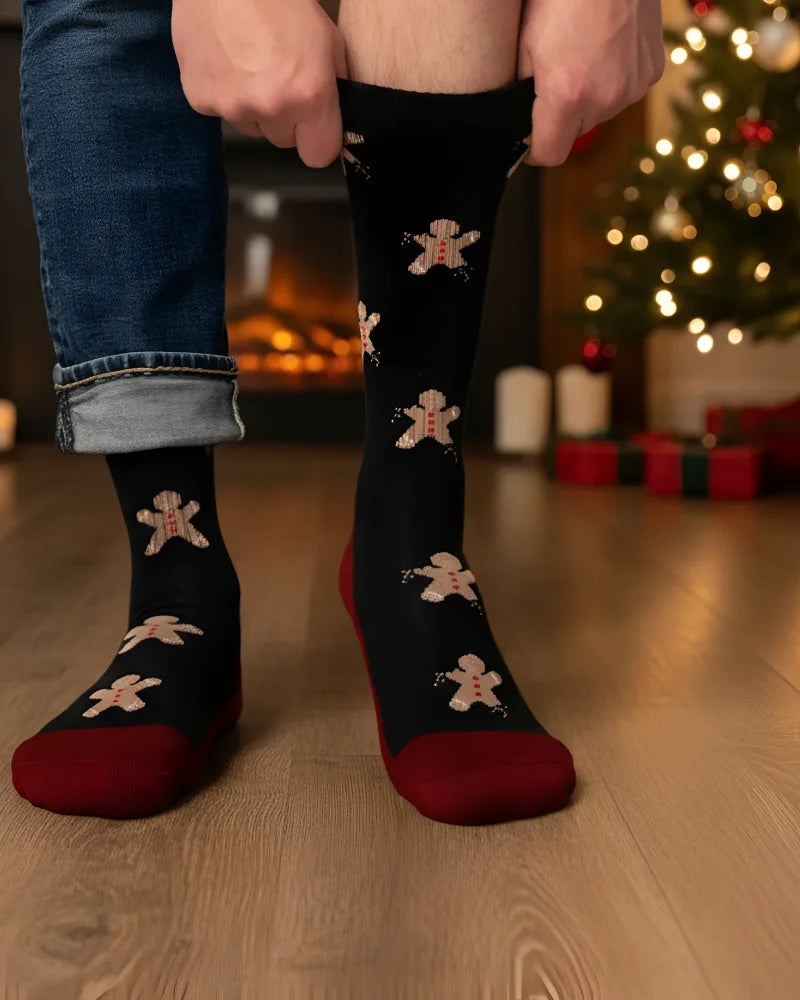 Men’s gingerbread bite merino wool socks in black with festive gingerbread pattern and maroon heel and toe accents