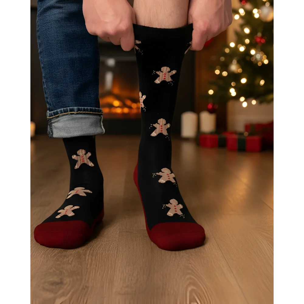 Men’s gingerbread bite merino wool socks in black with festive gingerbread pattern and maroon heel and toe accents