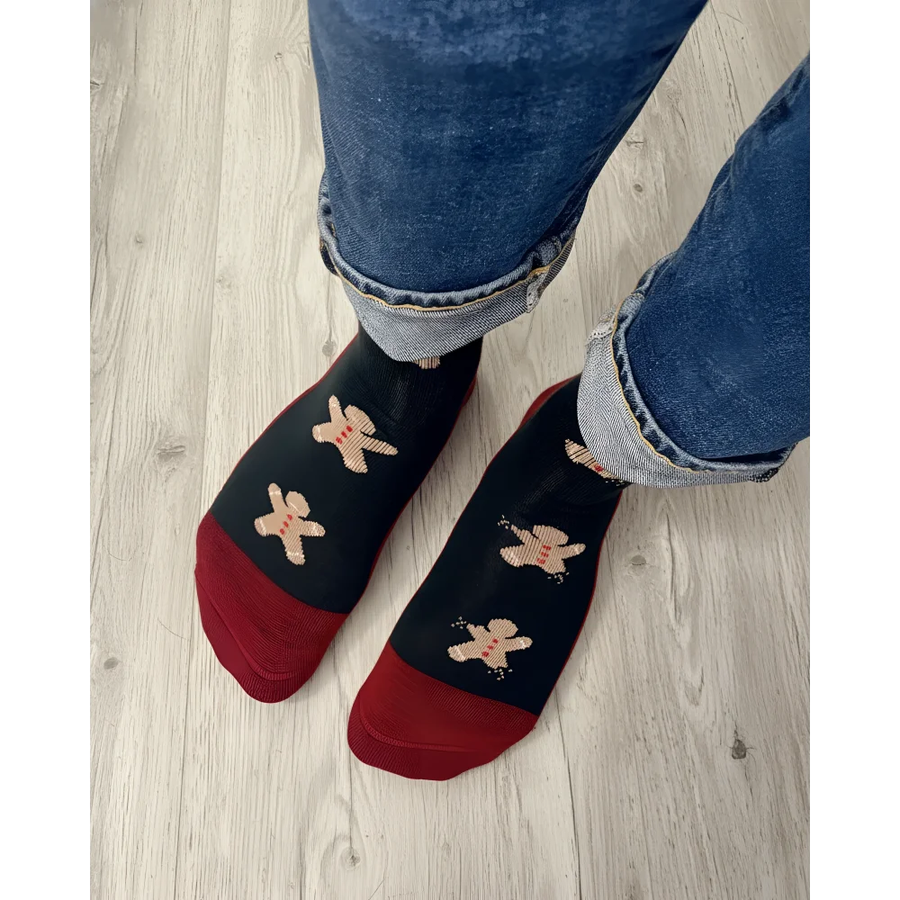 Men’s gingerbread bite merino wool socks in black and red with embroidered gingerbread men cozy wool socks