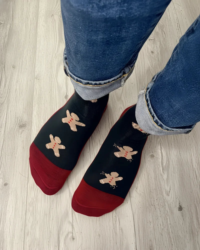 Men’s gingerbread bite merino wool socks in black and red with embroidered gingerbread men cozy wool socks