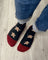 Men’s gingerbread bite merino wool socks in black and red with embroidered gingerbread men cozy wool socks