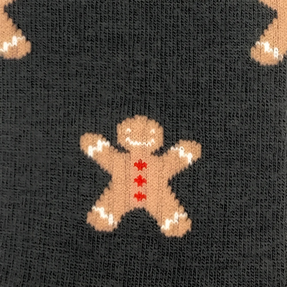 Men’s merino wool socks with a knitted gingerbread man design in tan red and white perfect for outdoor cozy wear