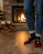 Men wearing black and red festive snowman merino wool socks with cuffed blue jeans for outdoor cozy warmth