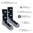 Men’s merino wool socks in black with gray toes and heels featuring white mountains and blue clouds pattern