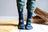 Dark blue merino wool socks with playful gold and light blue space patterns perfect for outdoor activity