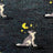 Dark green merino wool socks with a pixelated wolf under a yellow crescent moon and stars for men