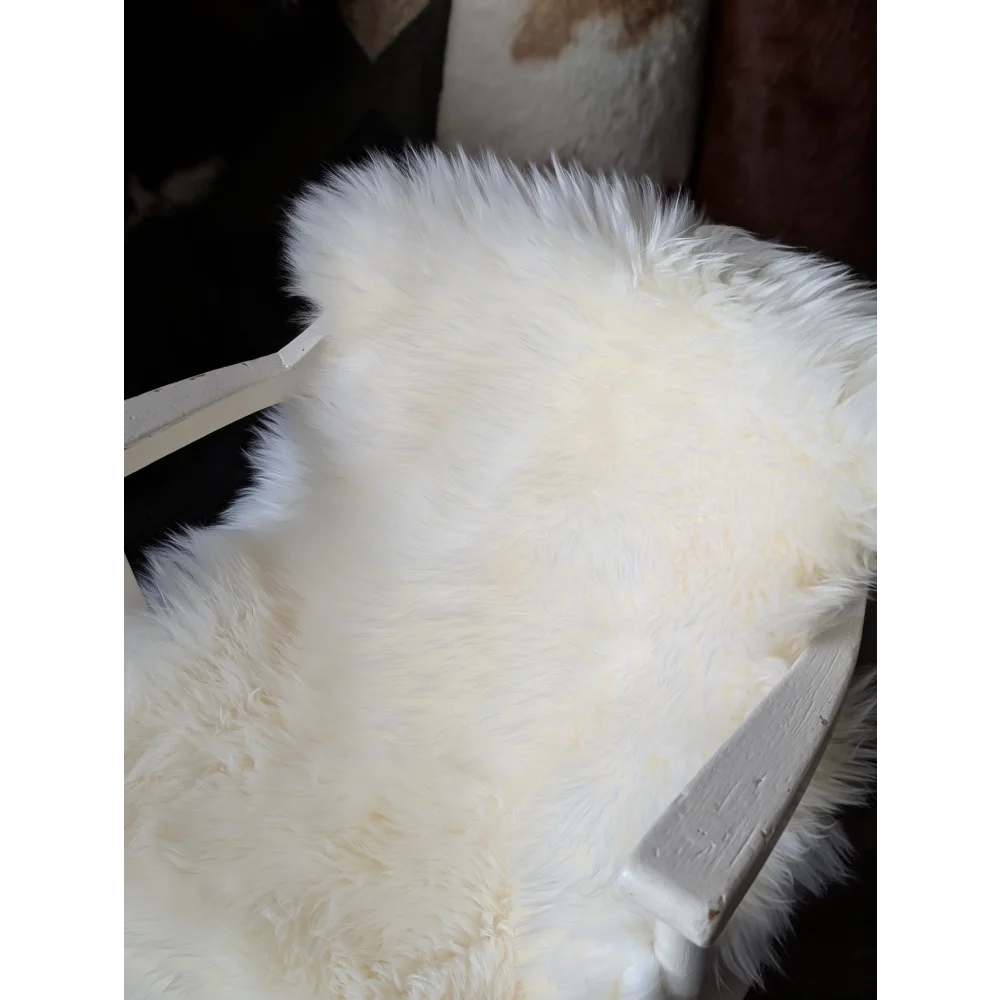 White fluffy oeko tex certified merino double sheepskin rug on chair