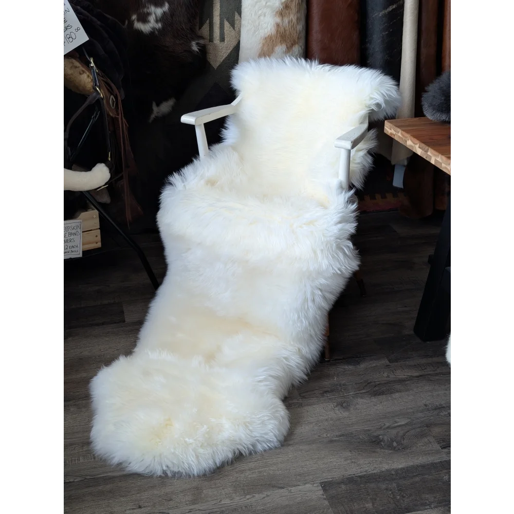 Oeko tex certified very soft merino double sheepskin on white armchair