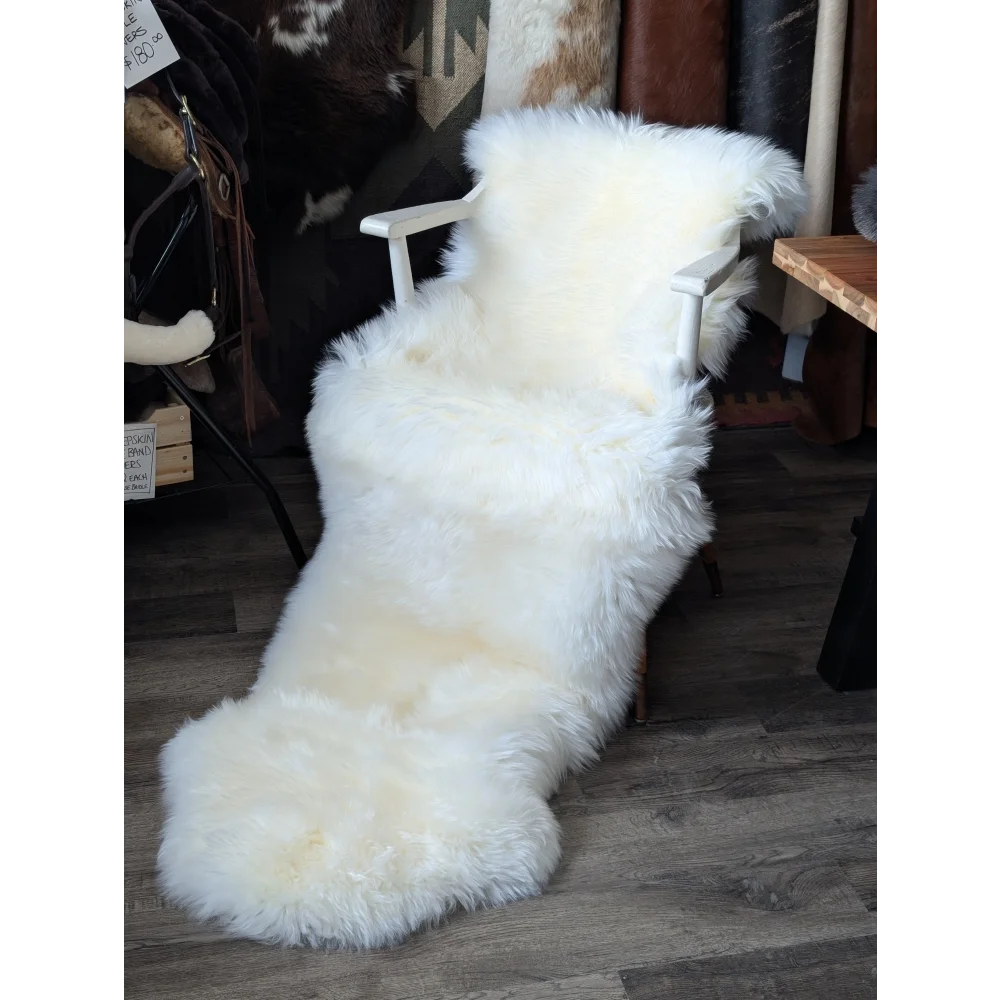 Oeko tex certified very soft merino double sheepskin on white armchair