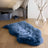 Blue dyed merino sheepskin rug with soft fluffy texture and irregular edges from dyed merino sheepskins collection