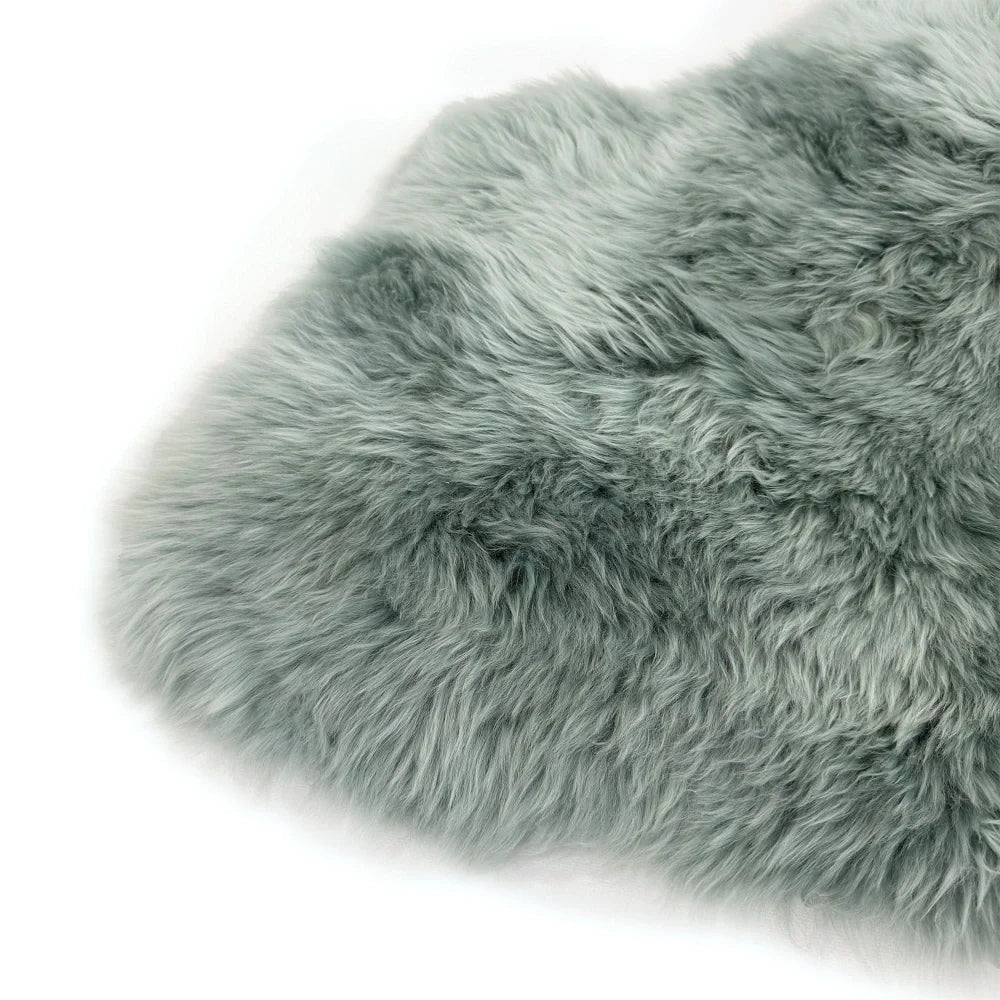 A soft light gray dyed merino sheepskin rug with plush curly texture from the merino sheepskins dyed colours range