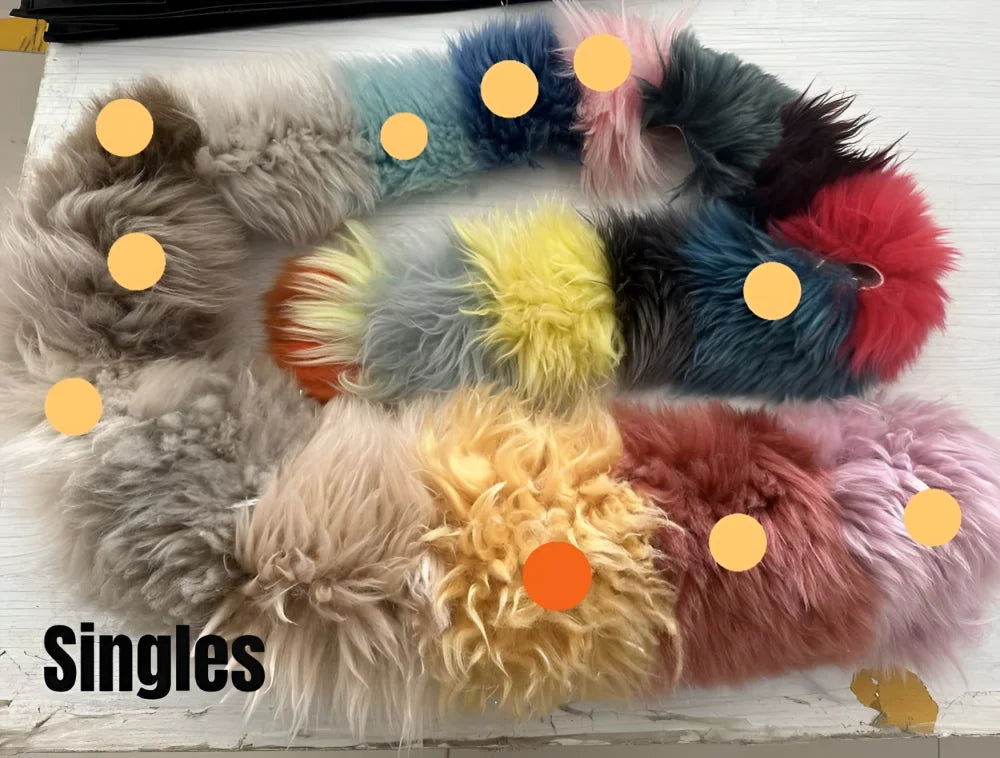 A collection of colorful fluffy merino sheepskins dyed colours faux fur necklaces in gray blue pink yellow and red