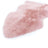 A soft fluffy pink dyed merino sheepskin rug with dense plush fur and natural irregular shape