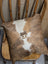 Brown and white mini moo double sided cowhide cushion with stitched on cow face design by angus oliver canada