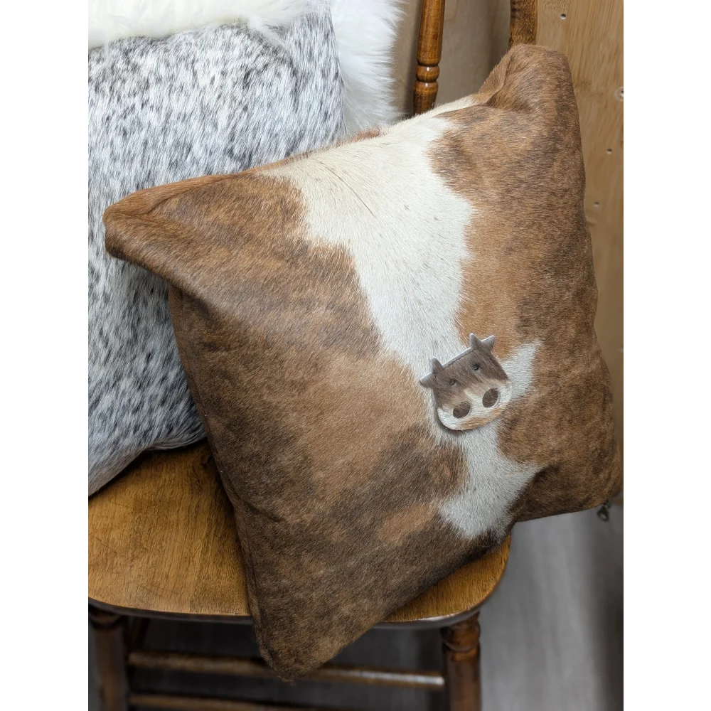 Mini moo brown and white cowhide cushion with stitched cow face design by angus oliver canada